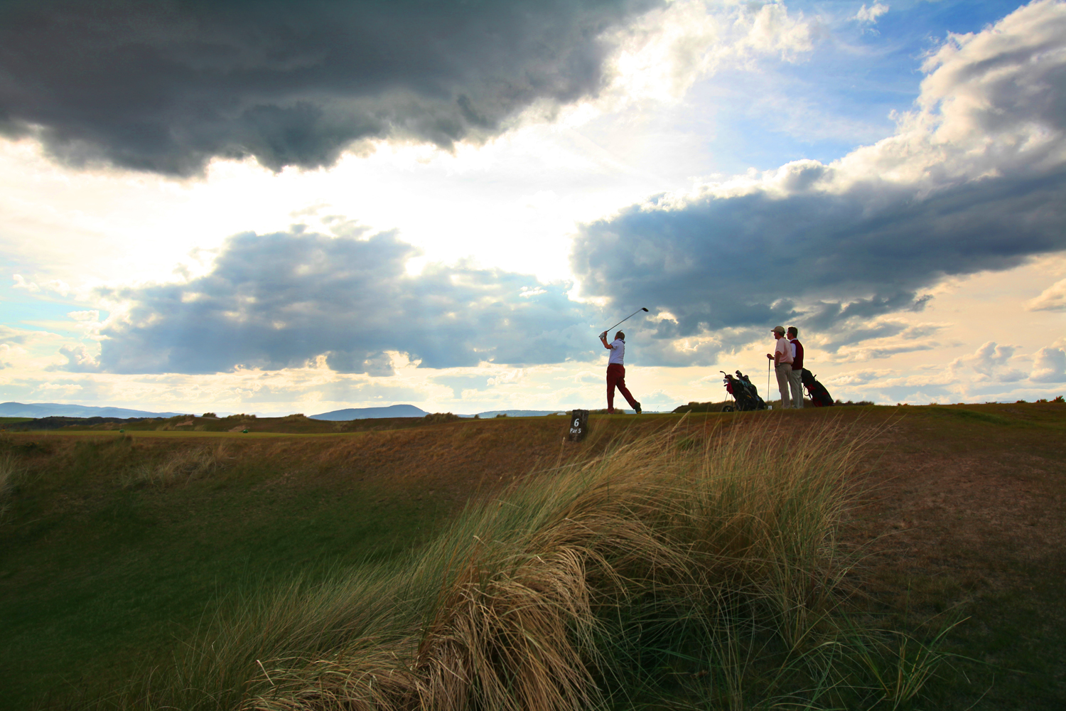 Golfers tee off at Castle Stuart Golf Links, Inverness